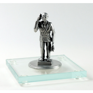 Miniatur Geschäftsmann auf Glassockel